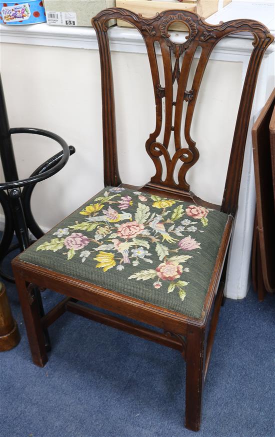 A set of eight dining chairs with tapestry upholstered seats, (six and two carvers)